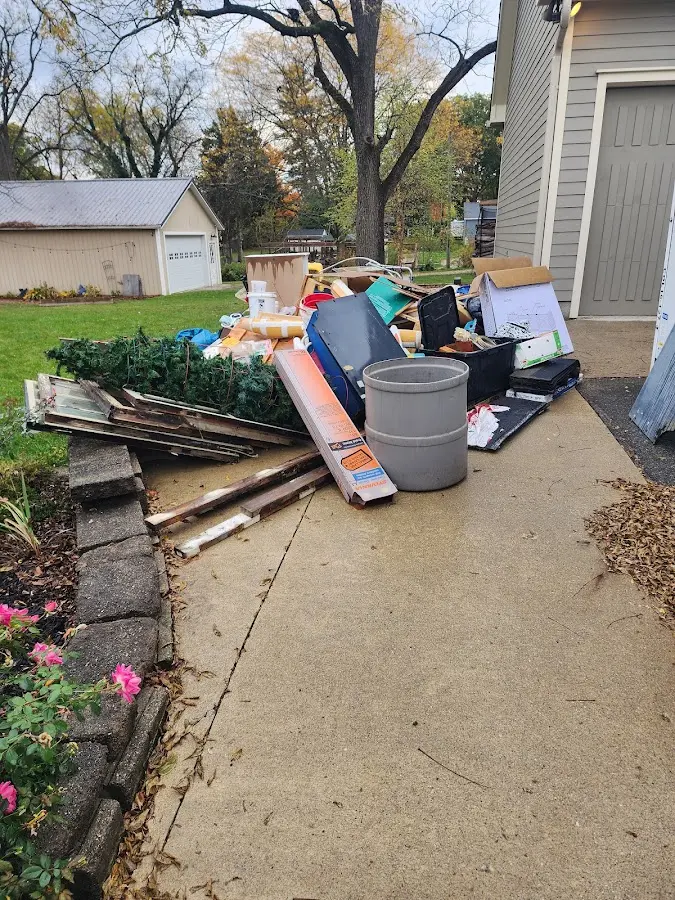 Dumpster being loaded with debris for 3 Yard Dumpster Rental in Zephyrhills West